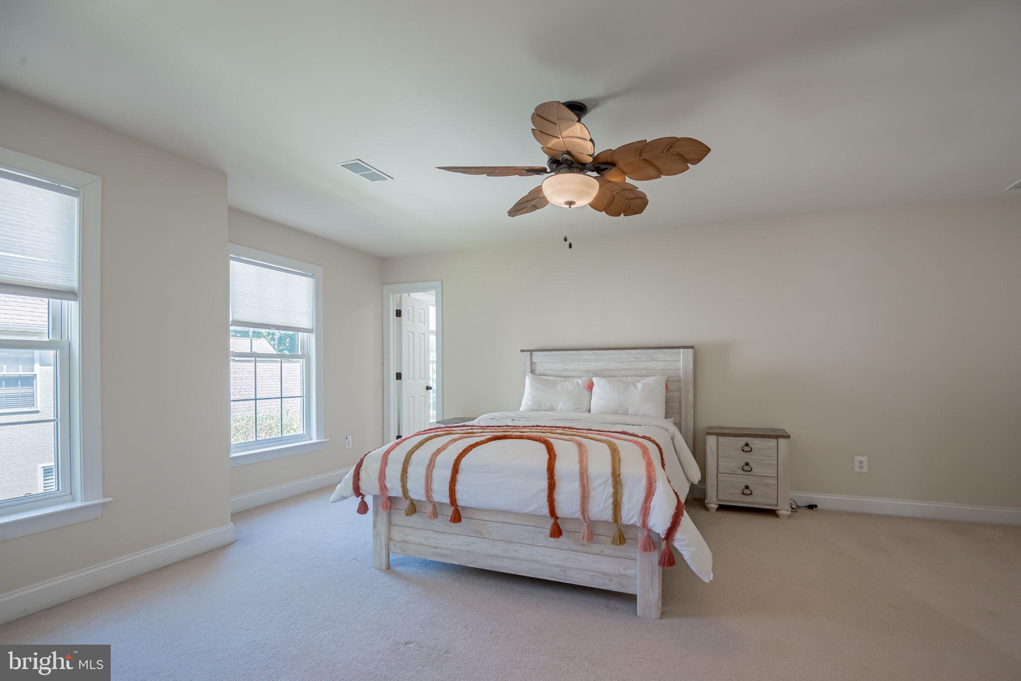 125 Cornwall Road Rehoboth Beach, DE 19971 - Photo 43 of 52 a bedroom with a bed and window