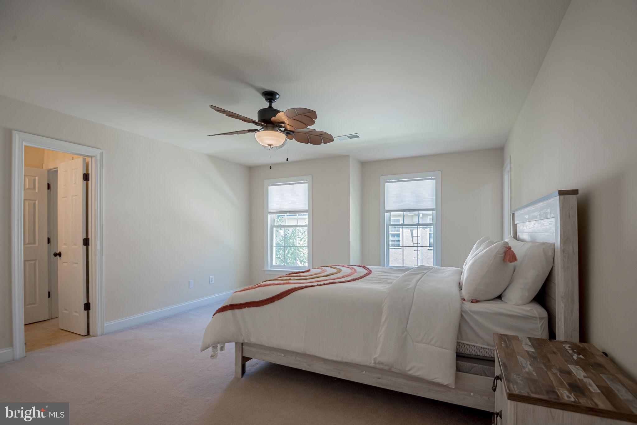 125 Cornwall Road Rehoboth Beach, DE 19971 - Photo 44 of 52 a bedroom with a bed and window