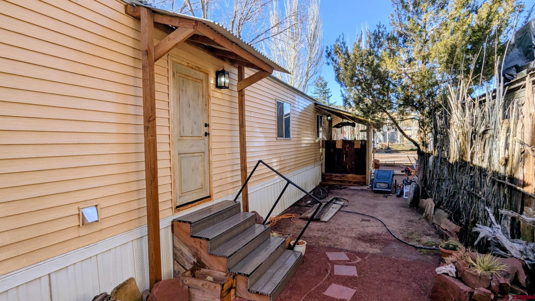 2403 County Road 203, Unit 44 Durango, CO 81301 - Photo 2 of 41 a view of backyard with a chair and wooden floor