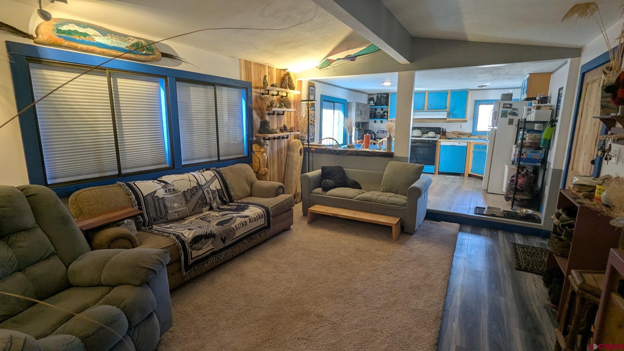 2403 County Road 203, Unit 44 Durango, CO 81301 - Photo 25 of 41 a living room with furniture and a flat screen tv