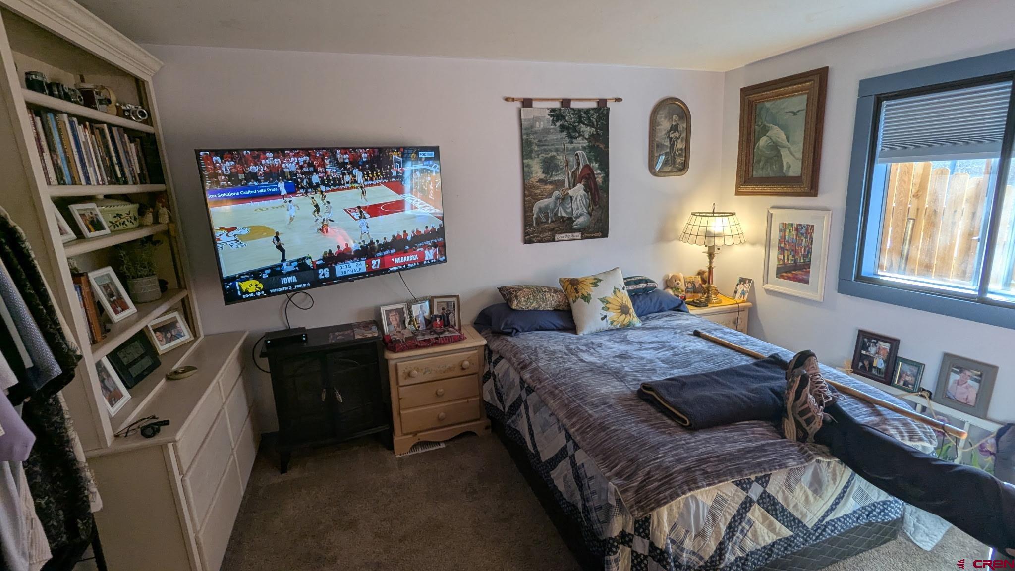 2403 County Road 203, Unit 44 Durango, CO 81301 - Photo 5 of 41 a bedroom with furniture and a painting on the wall