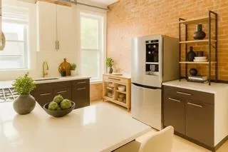 a kitchen with cabinets and window