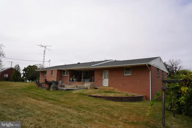a front view of house with yard and seating area