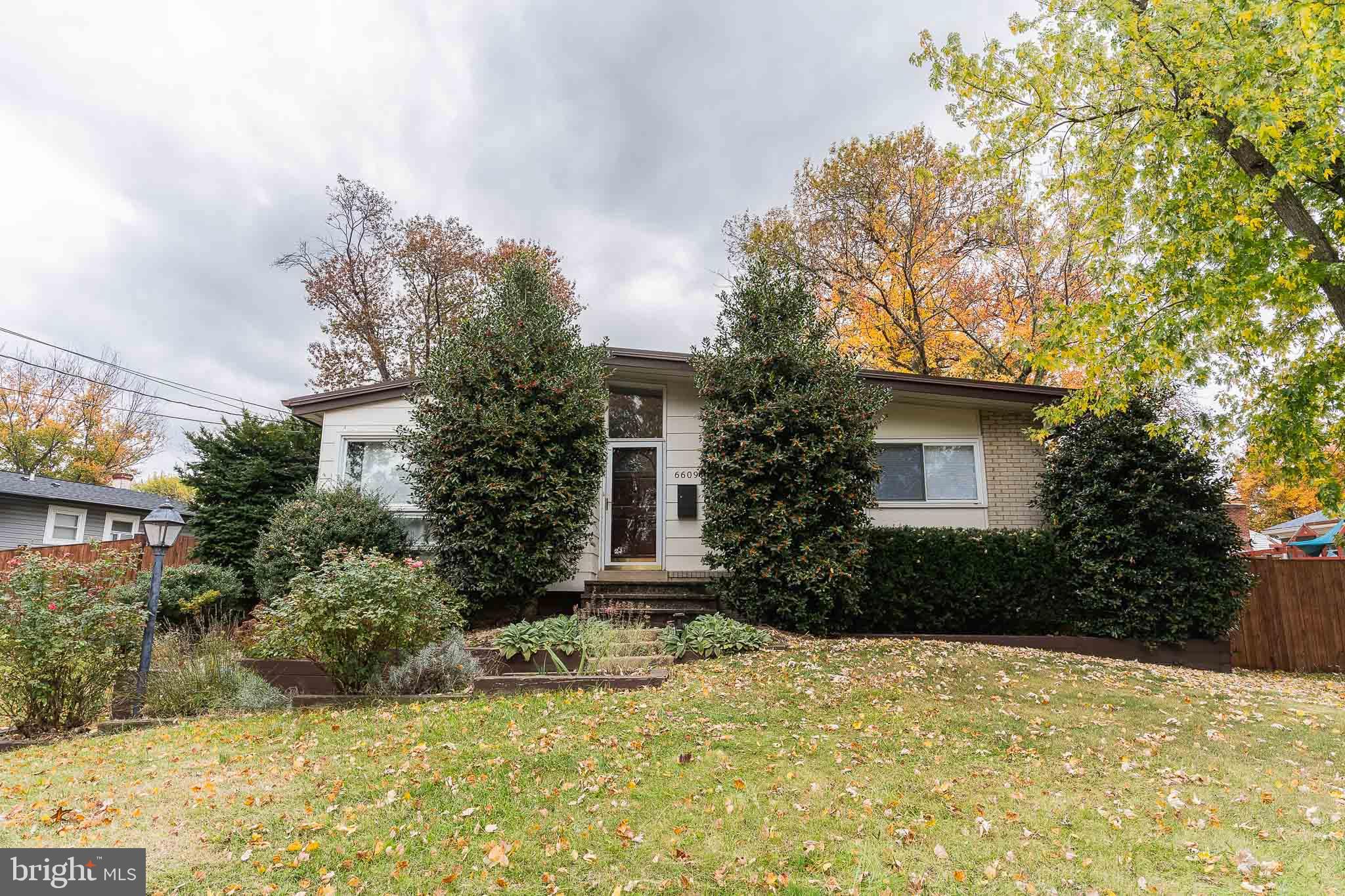 6609 Bowie Drive Springfield, VA 22150 - Photo 1 of 29 a view of a house with a yard