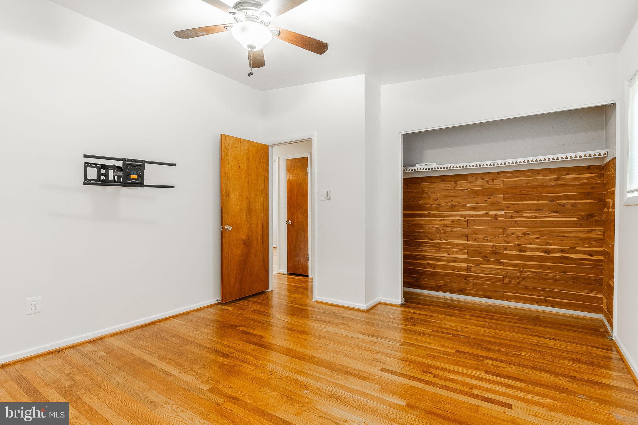 6609 Bowie Drive Springfield, VA 22150 - Photo 19 of 29 a view of empty room with wooden floor