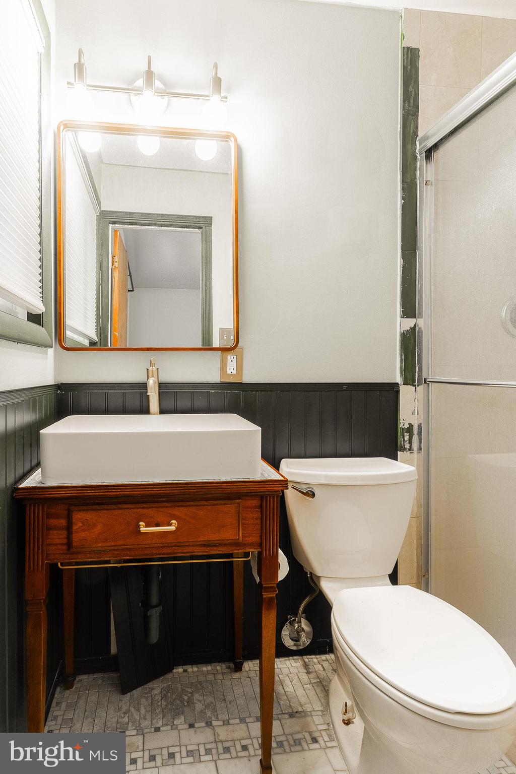 6609 Bowie Drive Springfield, VA 22150 - Photo 20 of 29 a bathroom with a toilet a sink and a mirror