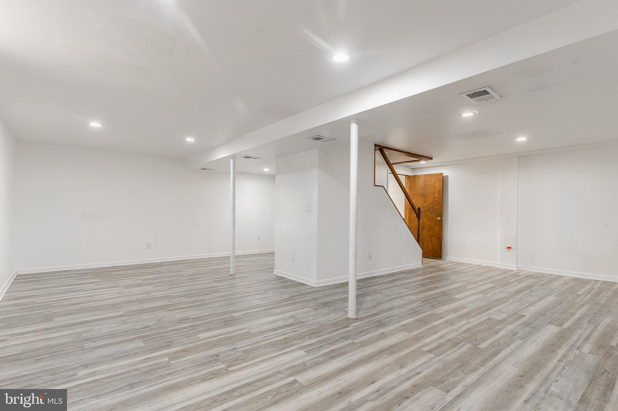 6609 Bowie Drive Springfield, VA 22150 - Photo 25 of 29 a view of an empty room with wooden floor