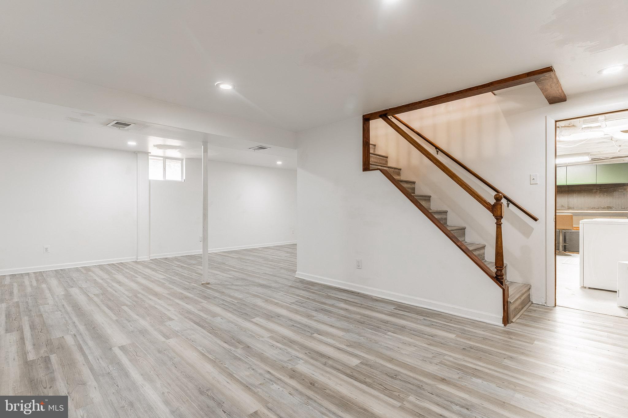 6609 Bowie Drive Springfield, VA 22150 - Photo 26 of 29 a view of an empty room with wooden floor