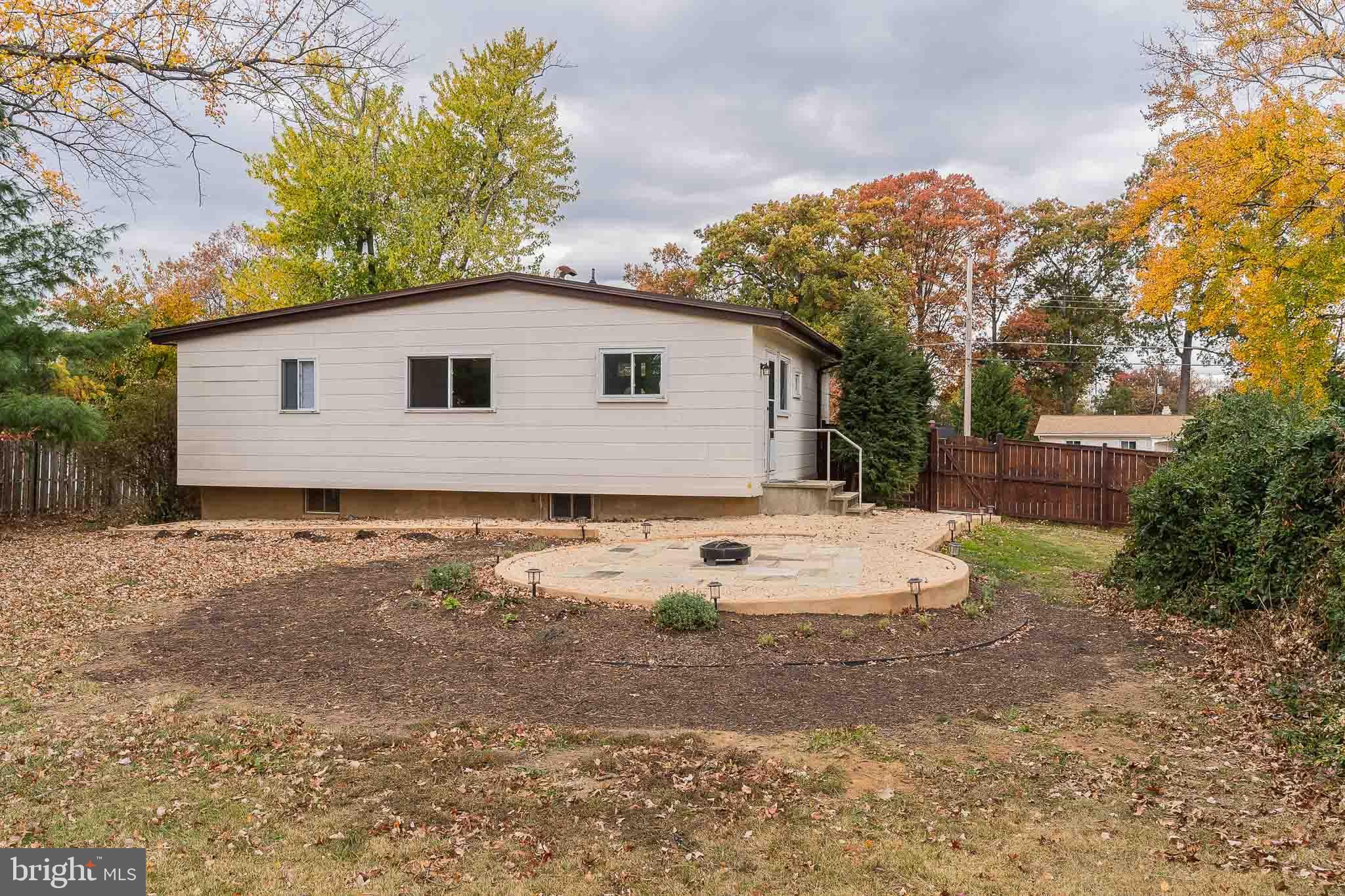 6609 Bowie Drive Springfield, VA 22150 - Photo 28 of 29 a view of a house with a yard and a large tree