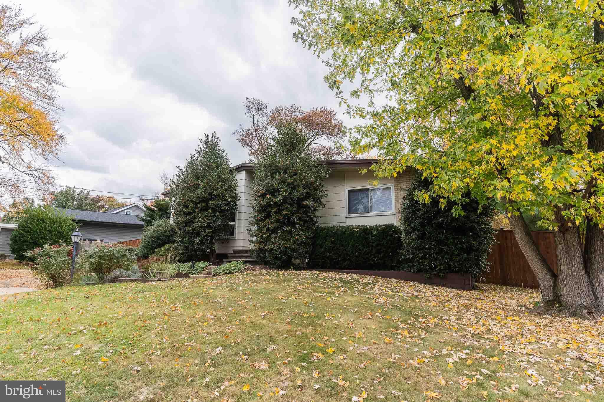 6609 Bowie Drive Springfield, VA 22150 - Photo 3 of 29 a front view of a house with a yard