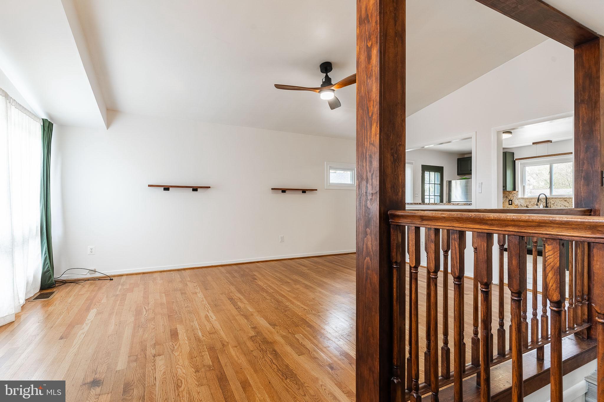 6609 Bowie Drive Springfield, VA 22150 - Photo 4 of 29 a view of a room with wooden floor and a window
