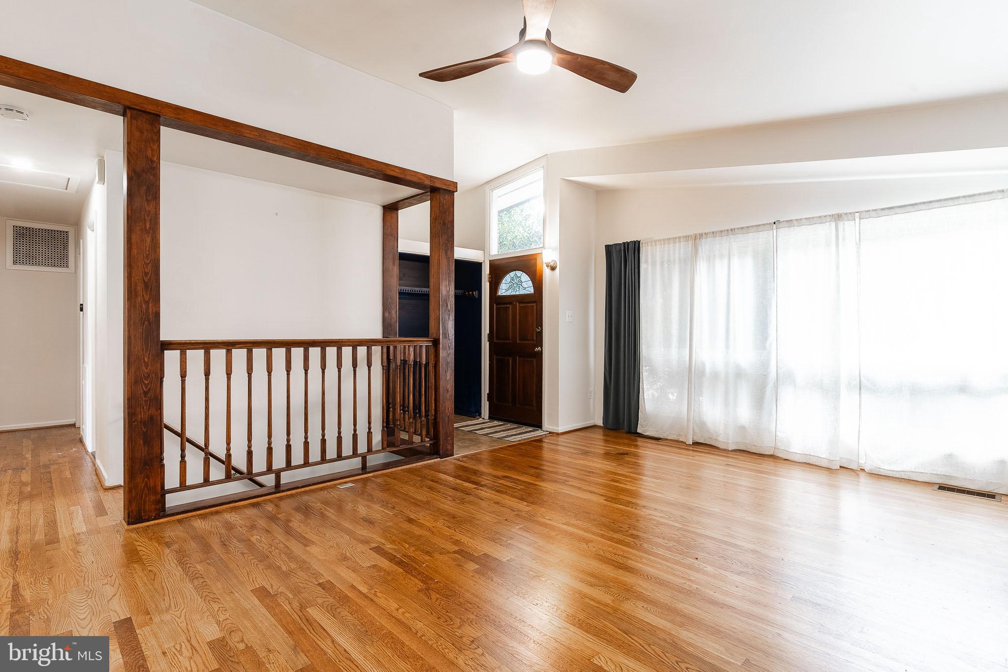 6609 Bowie Drive Springfield, VA 22150 - Photo 8 of 29 wooden floor in an empty room with a window