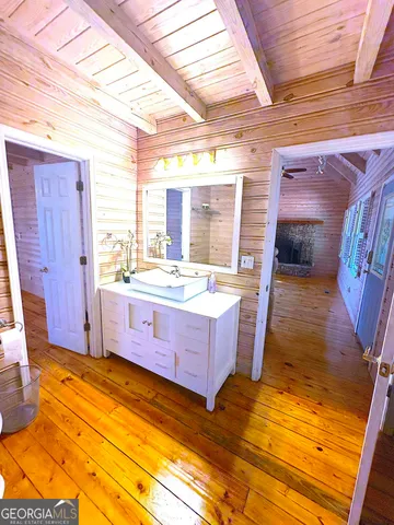 a view of door with wooden floor