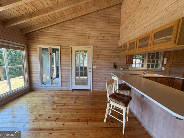 a view of a terrace with wooden floor and a ceiling fan