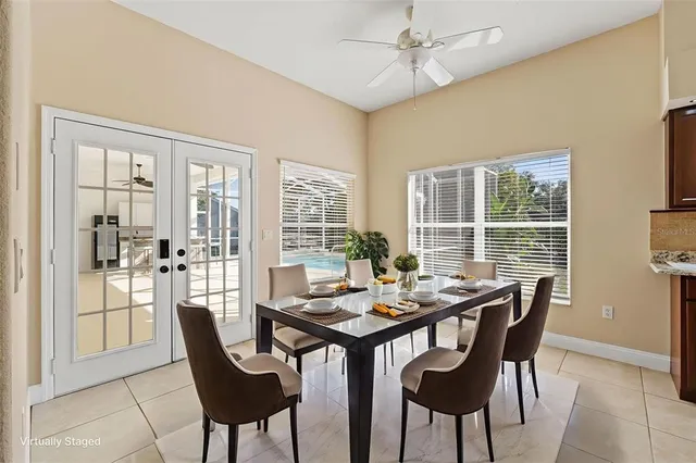 a view of a dining room with furniture and window