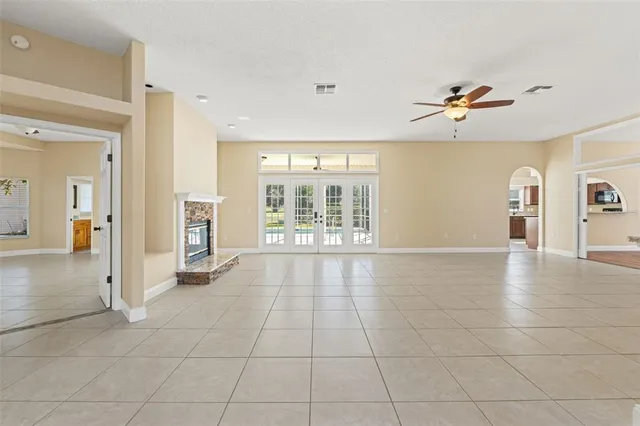 a bathroom with a granite countertop double vanity sink and a mirror