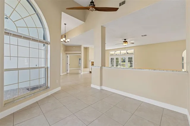 a bathroom with a granite countertop sink mirror vanity and toilet
