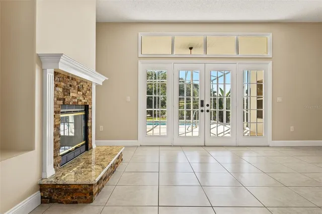 a spacious bathroom with a granite countertop sink a mirror and a shower