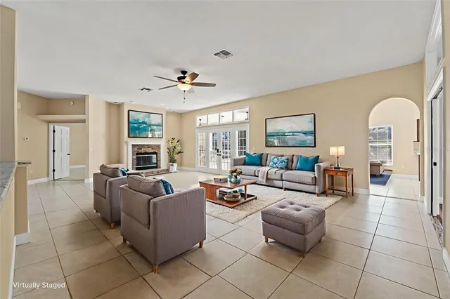 a view of a yard with plants and a fountain
