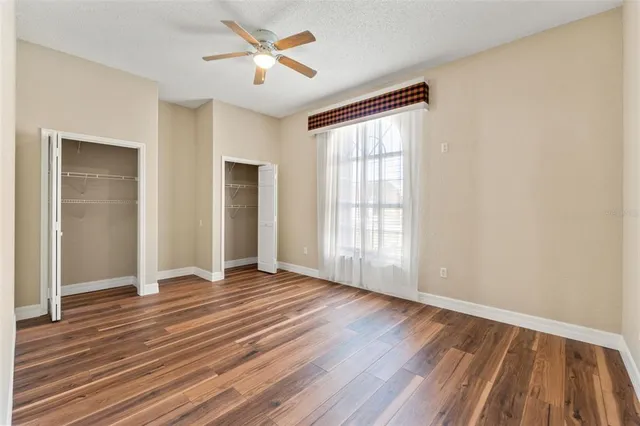 a view of a backyard with swimming pool