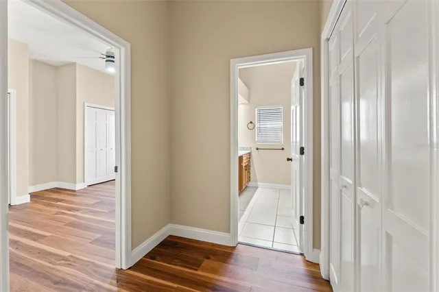 a view of a house with backyard porch and sitting area