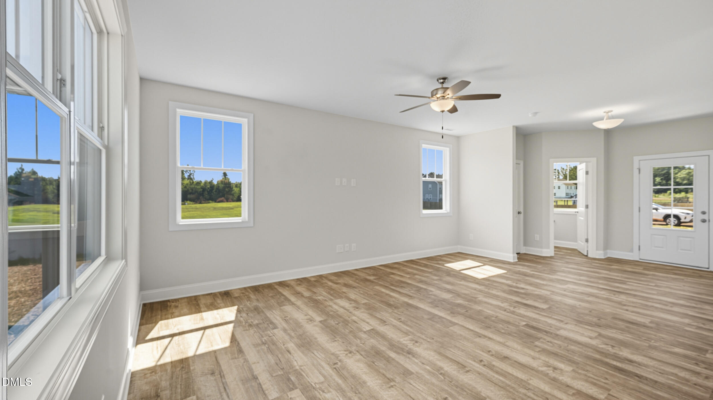 4105 Ralph Holt Court Snow Camp, NC 27349 - Photo 11 of 35 wooden floor in an empty room with a window