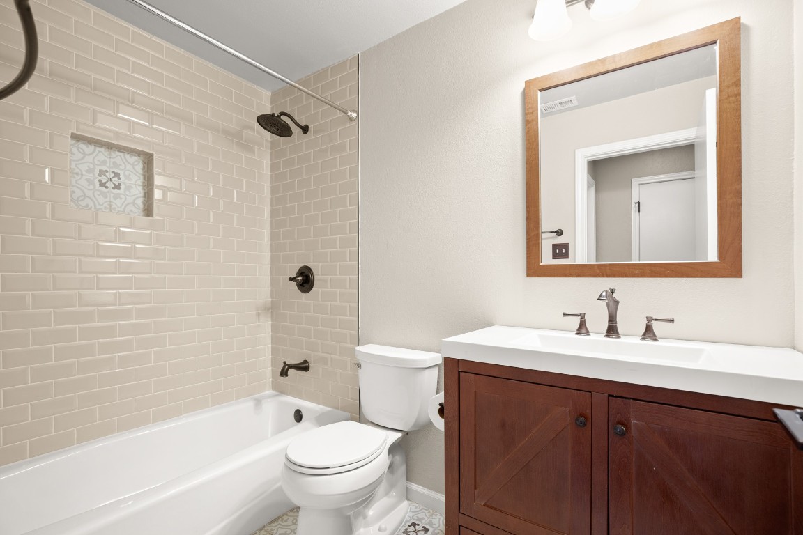 4711 Spicewood Springs Road, Unit 260 Austin, TX 78759 - Photo 16 of 20 a bathroom with a sink a toilet and shower