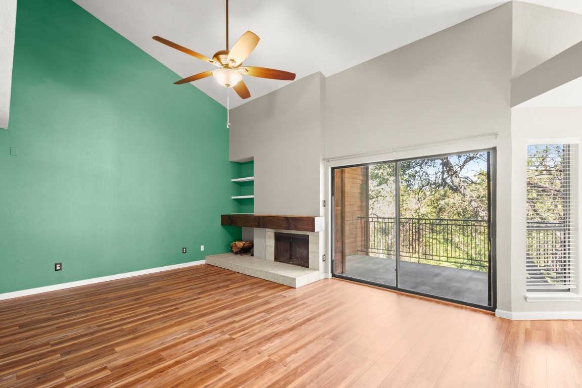 4711 Spicewood Springs Road, Unit 260 Austin, TX 78759 - Photo 5 of 20 a bedroom with a bed and a ceiling fan