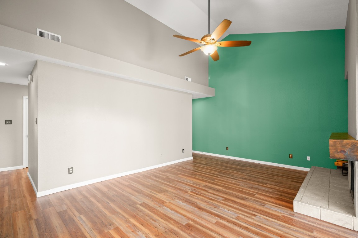 4711 Spicewood Springs Road, Unit 260 Austin, TX 78759 - Photo 6 of 20 a view of a room with wooden floor and fan