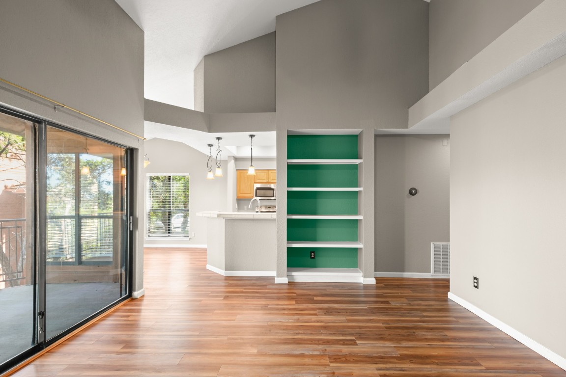 4711 Spicewood Springs Road, Unit 260 Austin, TX 78759 - Photo 8 of 20 a view of a room with wooden floor and windows