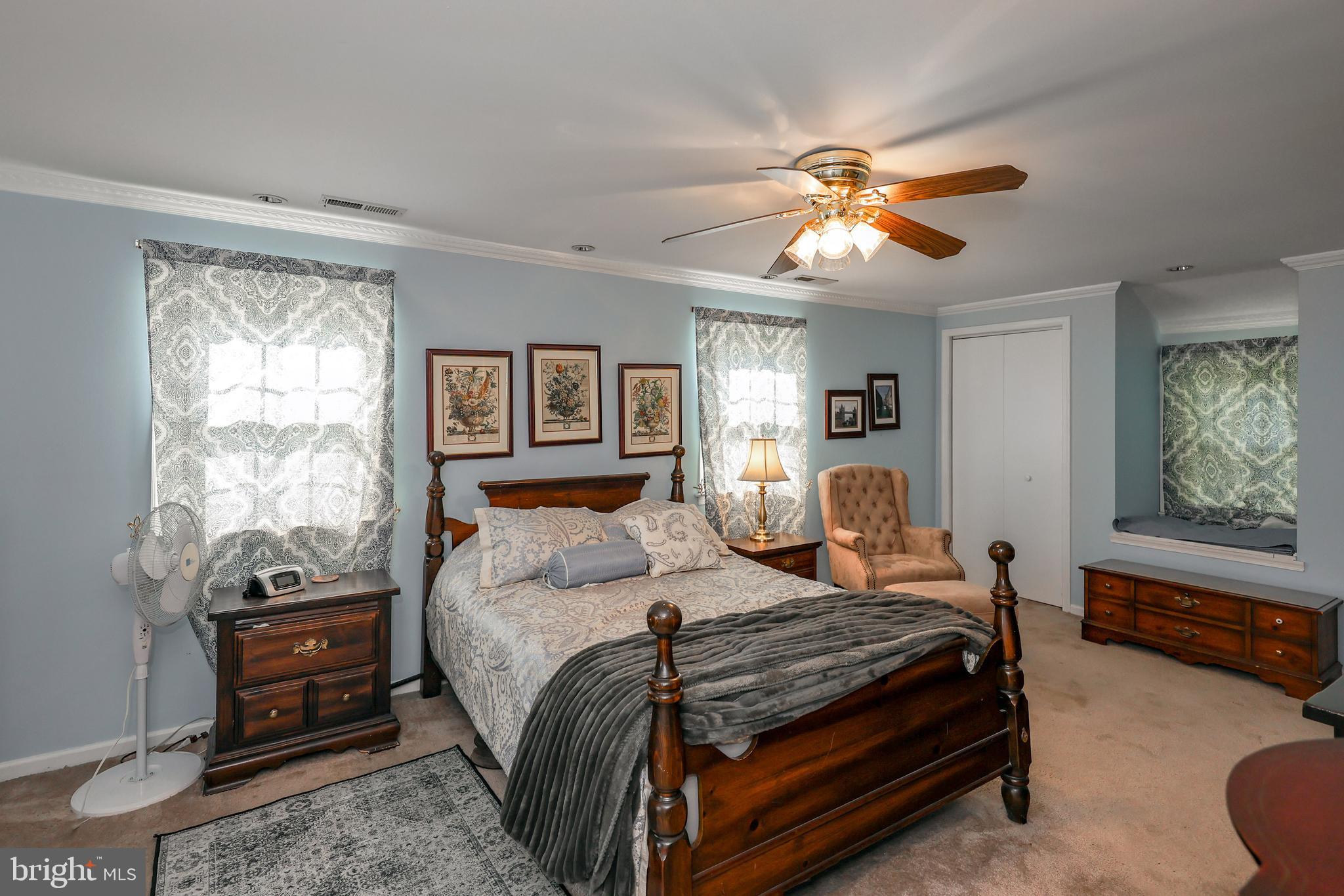 571 Rutherford Drive Springfield, PA 19064 - Photo 22 of 36 a bedroom with a bed and a chandelier