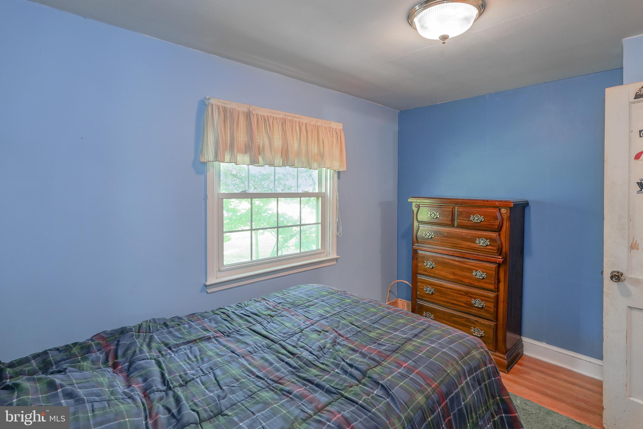 571 Rutherford Drive Springfield, PA 19064 - Photo 29 of 36 a bedroom with a bed and a closet