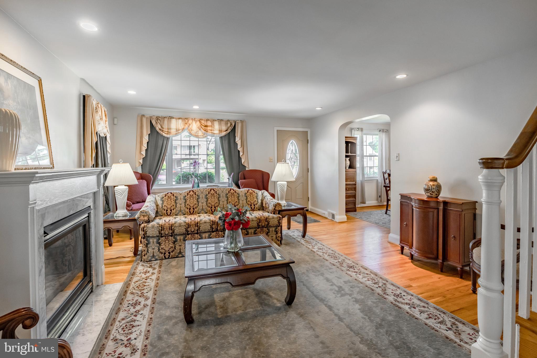 571 Rutherford Drive Springfield, PA 19064 - Photo 3 of 36 a living room with furniture a window and a fireplace