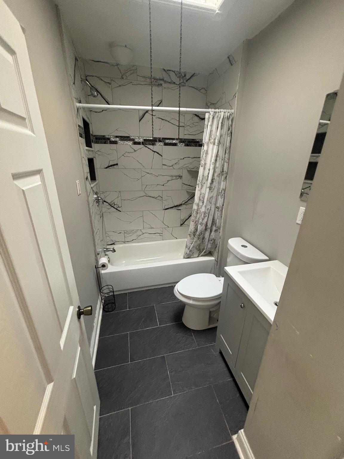 5807 Master Street Philadelphia, PA 19131 - Photo 12 of 21 a bathroom with a toilet a sink and shower