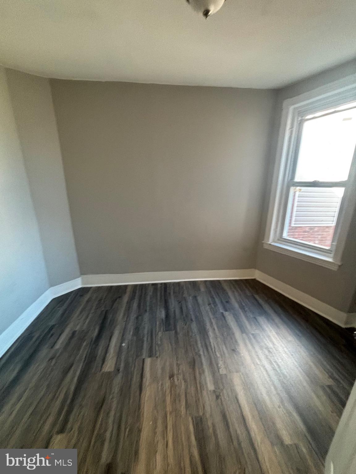 5807 Master Street Philadelphia, PA 19131 - Photo 14 of 21 an empty room with wooden floor and windows