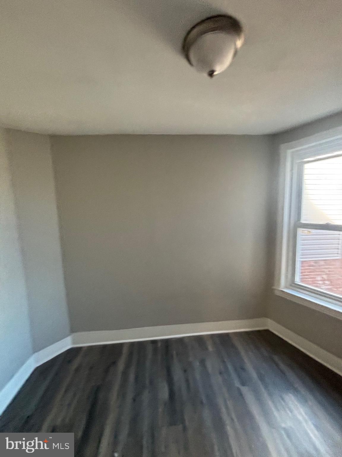 5807 Master Street Philadelphia, PA 19131 - Photo 15 of 21 an empty room with wooden floor and windows