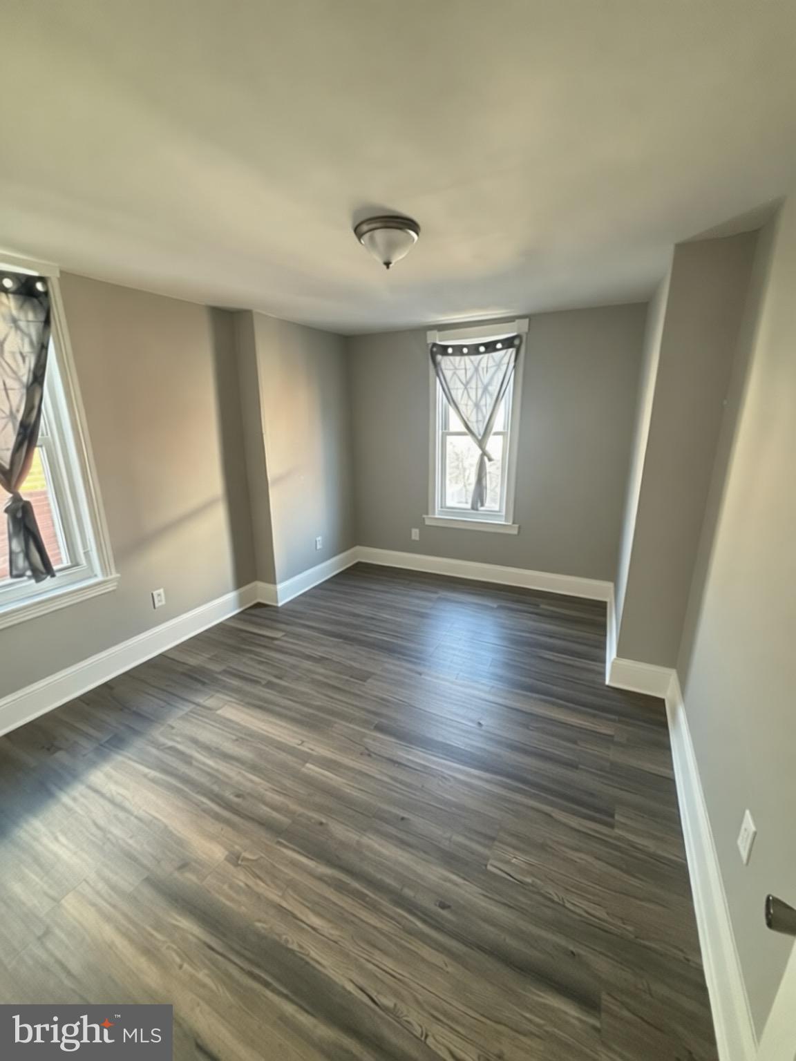 5807 Master Street Philadelphia, PA 19131 - Photo 16 of 21 an empty room with wooden floor and windows