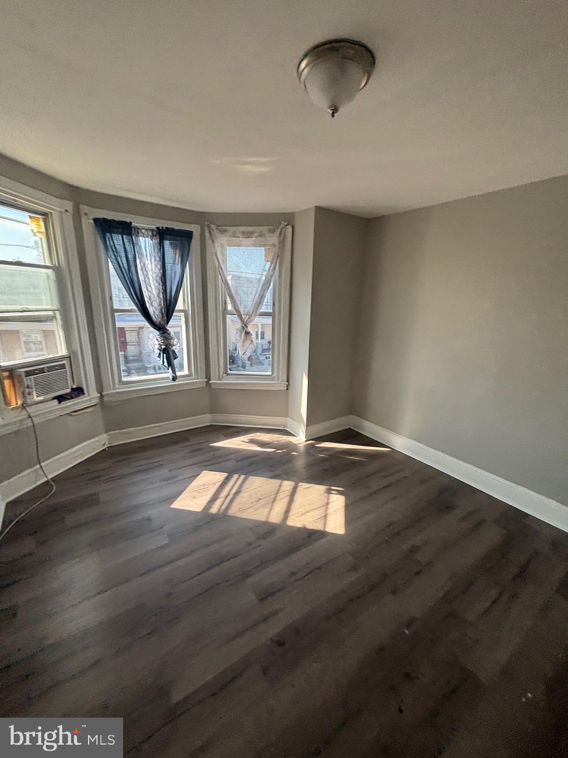 5807 Master Street Philadelphia, PA 19131 - Photo 17 of 21 an empty room with wooden floor and windows