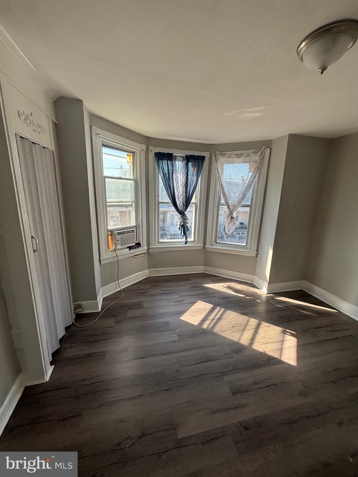 5807 Master Street Philadelphia, PA 19131 - Photo 18 of 21 an empty room with wooden floor and windows