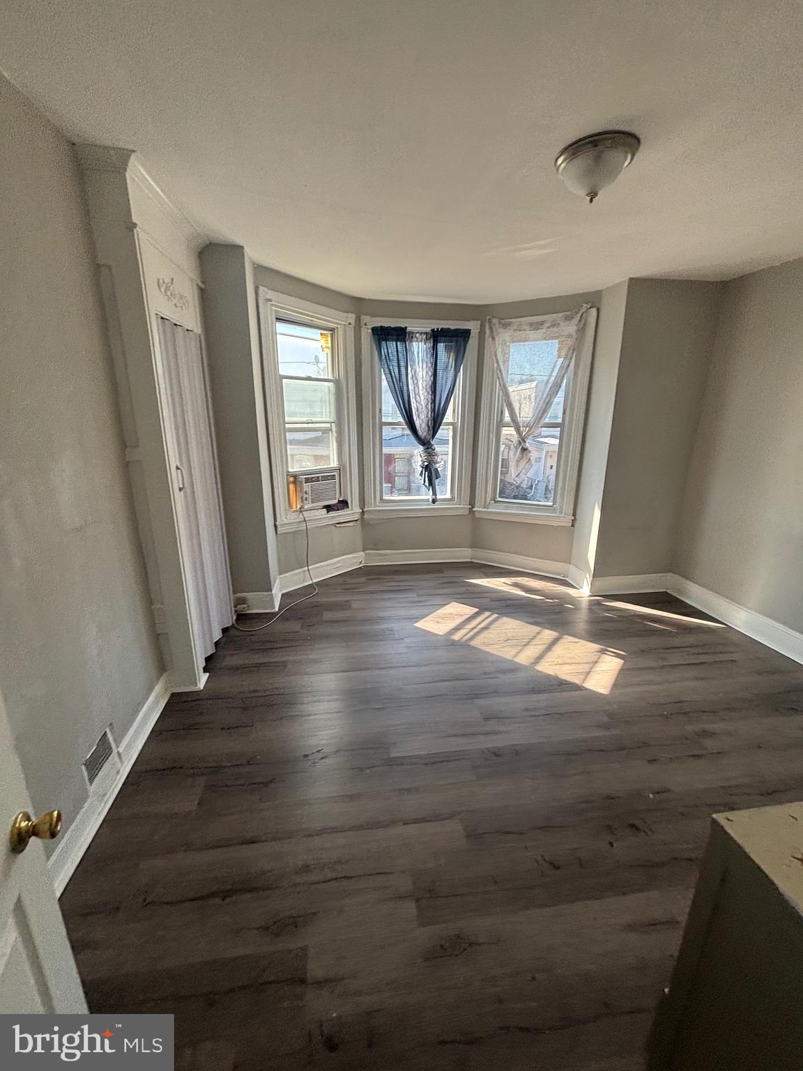 5807 Master Street Philadelphia, PA 19131 - Photo 19 of 21 a view of an empty room with wooden floor and a window