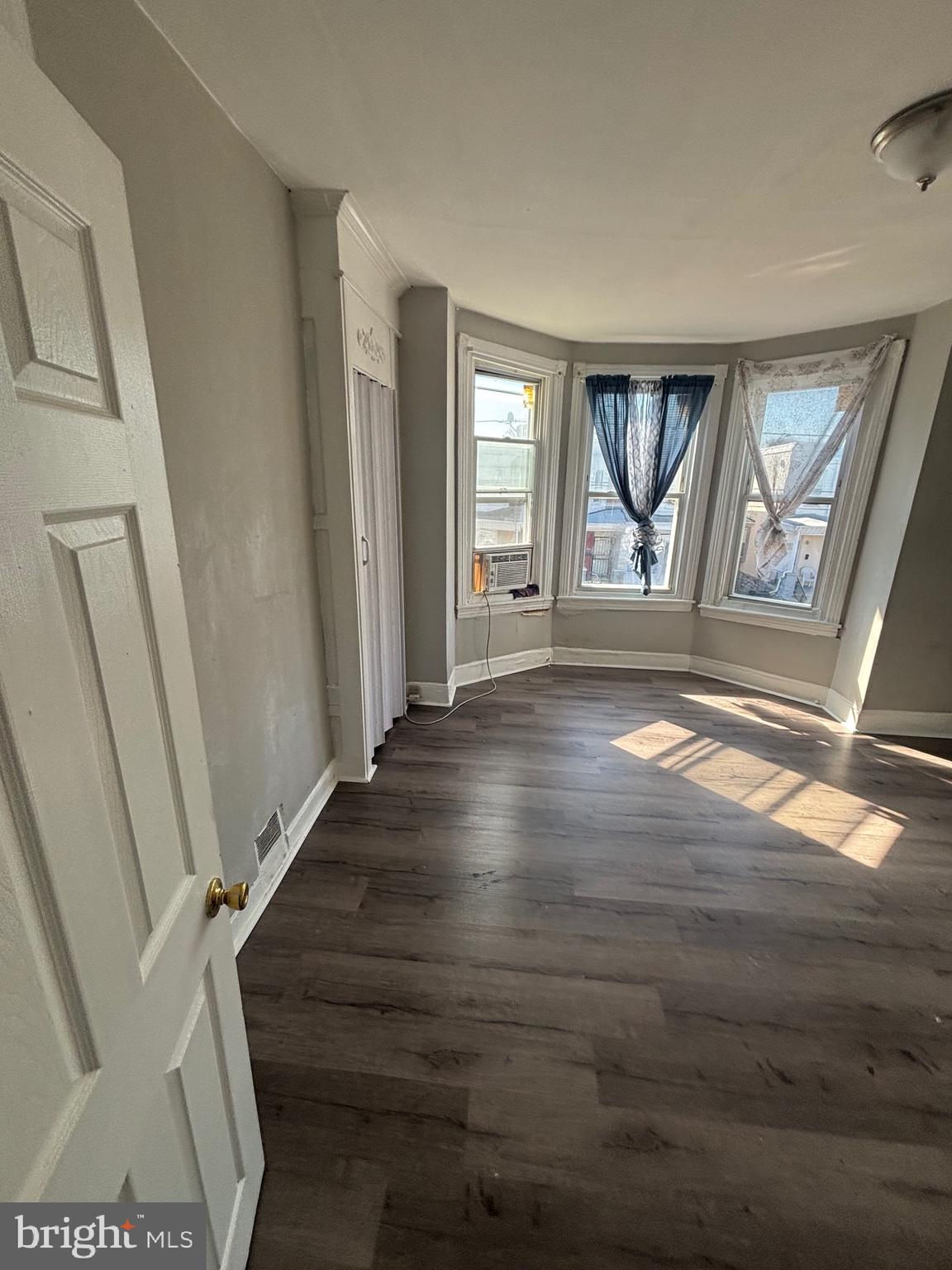 5807 Master Street Philadelphia, PA 19131 - Photo 20 of 21 a view of an empty room with wooden floor and a window