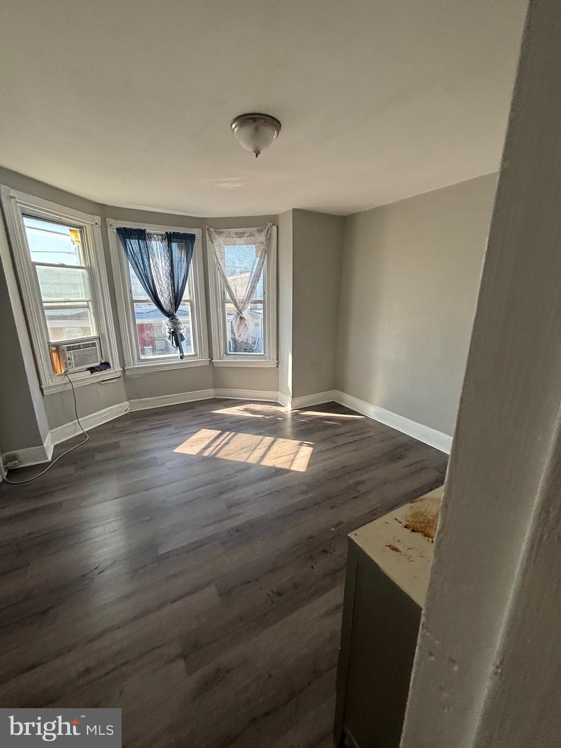 5807 Master Street Philadelphia, PA 19131 - Photo 21 of 21 an empty room with wooden floor and windows