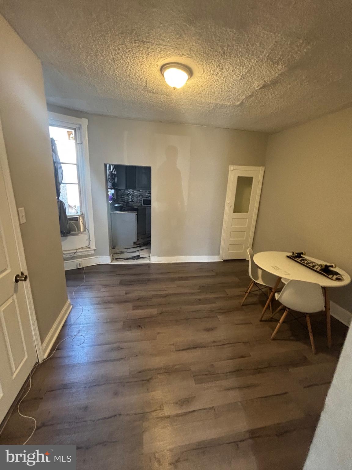 5807 Master Street Philadelphia, PA 19131 - Photo 4 of 21 a view of an empty room with wooden floor and a window