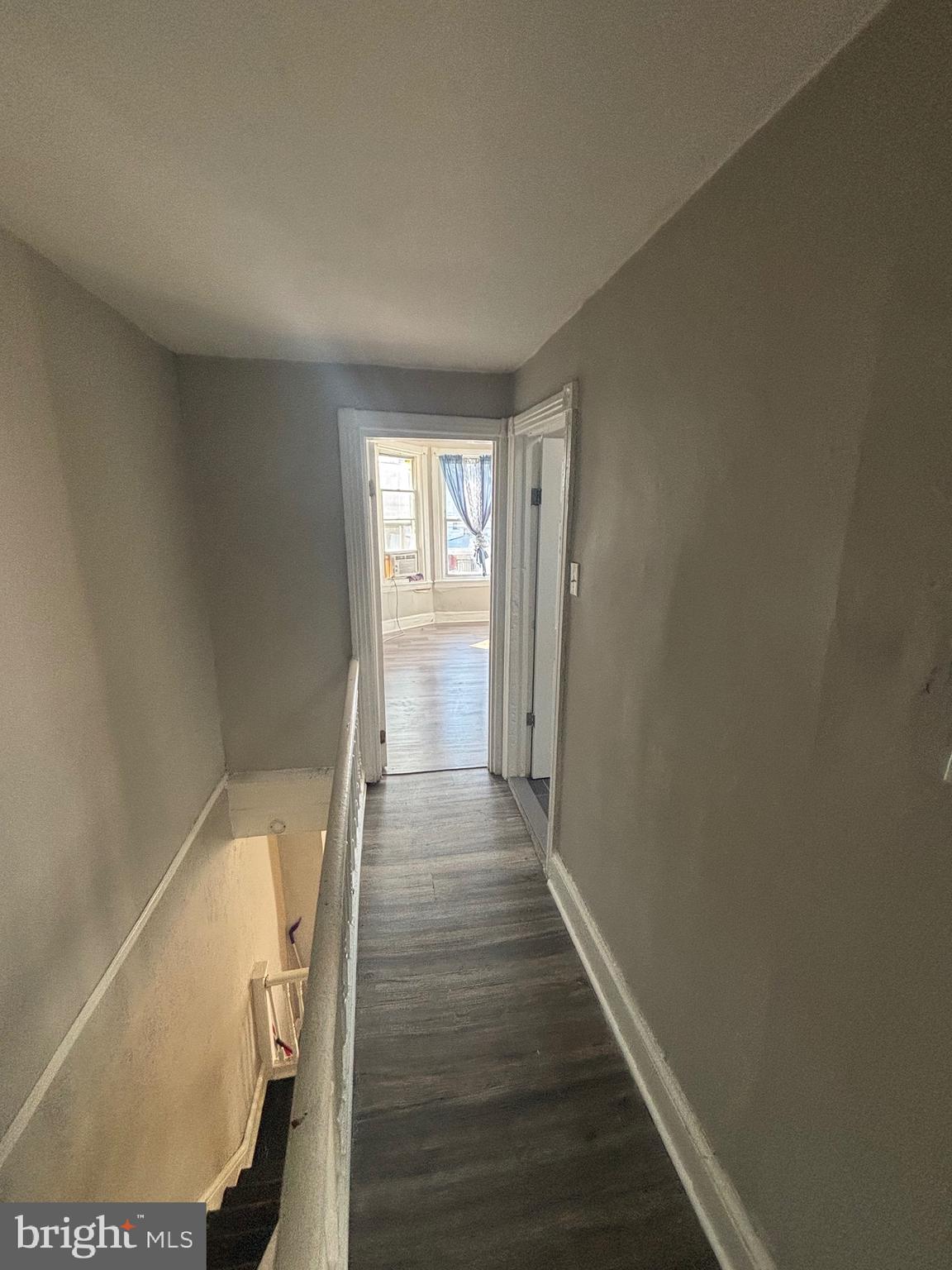 5807 Master Street Philadelphia, PA 19131 - Photo 9 of 21 a view of a hallway with wooden floor and staircase