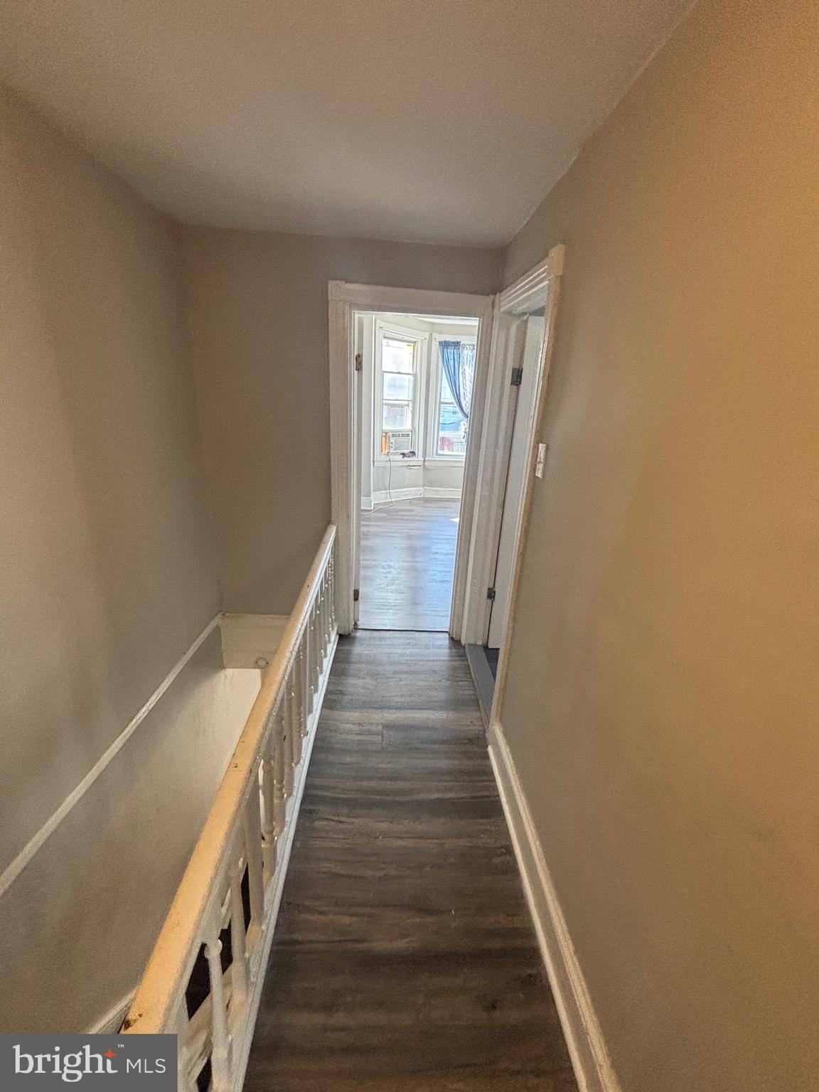 5807 Master Street Philadelphia, PA 19131 - Photo 10 of 21 a view of a hallway with wooden floor and staircase