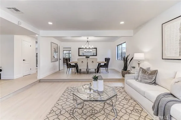 a kitchen with stainless steel appliances granite countertop a stove refrigerator sink and dishwasher