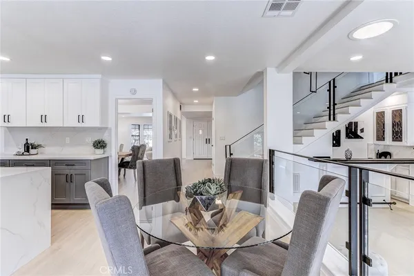 a living room with furniture a rug and a fireplace
