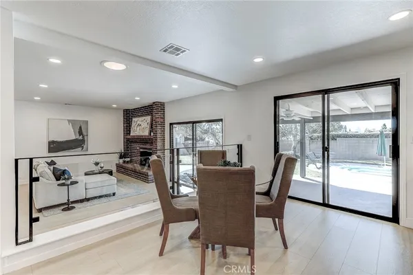 a living room with furniture and kitchen view