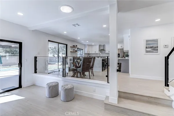 a bedroom with a bed and glass window