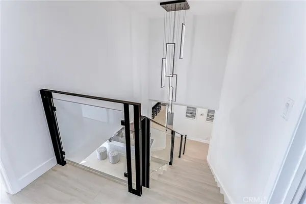 a bathroom with a double vanity sink toilet mirror and shower